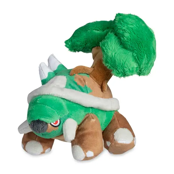 Peluche oficial Torterra Pokémon Center con árbol y caparazón verde marrón fondo blanco